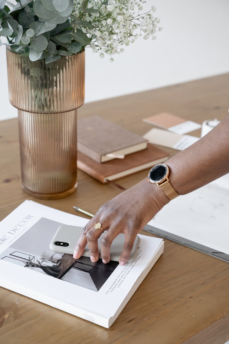 Elegant Office Person Reaching for Phone Work Desk